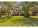 Charming home with mature landscaping, a well-manicured lawn, and an inviting front facade at 8974, 8972 & 8970 Nc 90 E Hwy, Stony Point, NC 28678