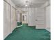 Inviting hallway features teal carpet, multiple closets and doorways leading to other rooms at 8974, 8972 & 8970 Nc 90 E Hwy, Stony Point, NC 28678