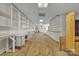 Large room featuring ample shelving, fluorescent lighting and unfinished floor at 8974, 8972 & 8970 Nc 90 E Hwy, Stony Point, NC 28678