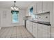 Charming kitchen with tile floors, black countertops, and bright white cabinetry at 8974, 8972 & 8970 Nc 90 E Hwy, Stony Point, NC 28678