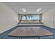 Meeting room with blue carpet, white walls, and large window views at 8974, 8972 & 8970 Nc 90 E Hwy, Stony Point, NC 28678