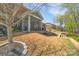 Beautiful backyard with screened porch and a well-maintained lawn, great for entertaining at 9032 Cornflower Dr, Harrisburg, NC 28075