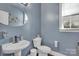 Charming bathroom features stylish fixtures, sleek sink, and a window providing natural light at 9032 Cornflower Dr, Harrisburg, NC 28075