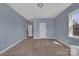 This bedroom has neutral walls, carpet floors and natural light at 9032 Cornflower Dr, Harrisburg, NC 28075