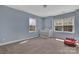 This bedroom offers natural light and carpet floors at 9032 Cornflower Dr, Harrisburg, NC 28075