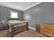 Bedroom showcasing neutral walls, carpet floors and wood furniture at 9032 Cornflower Dr, Harrisburg, NC 28075