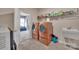 Organized laundry room with modern washer and dryer, sink, and ample storage at 9032 Cornflower Dr, Harrisburg, NC 28075
