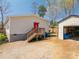 Backyard with garage, deck, and house at 980 Lakeland Ave, Lincolnton, NC 28092
