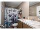 Bathroom with single sink vanity and shower with decorative curtain at 980 Lakeland Ave, Lincolnton, NC 28092