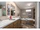 Bathroom featuring double sinks, bathtub, and decorative accents at 980 Lakeland Ave, Lincolnton, NC 28092