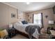 Cozy bedroom features warm colors and comfortable furnishings at 980 Lakeland Ave, Lincolnton, NC 28092
