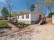Single story home with red shutters and landscaping at 980 Lakeland Ave, Lincolnton, NC 28092