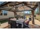 Gazebo on wooden deck with table and seating at 980 Lakeland Ave, Lincolnton, NC 28092