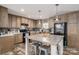 Beautiful kitchen with wood cabinets, brick backsplash, black appliances, and a large island at 980 Lakeland Ave, Lincolnton, NC 28092