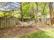 Private backyard featuring a relaxing hammock, mature trees, and a cozy atmosphere at 10609 Washam Potts Rd, Cornelius, NC 28031