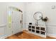 Inviting entryway features a modern cabinet with decor and beautiful hardwood floors at 10609 Washam Potts Rd, Cornelius, NC 28031