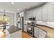 Modern kitchen features stainless steel appliances, granite countertops, and a kitchen island at 10609 Washam Potts Rd, Cornelius, NC 28031