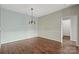 Spacious dining area with a modern light fixture, conveniently located near the entrance at 10720 Hill Point Ct, Charlotte, NC 28262