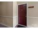 Condo entryway door with unit number and neutral wall decor creating a welcoming ambiance at 10720 Hill Point Ct, Charlotte, NC 28262