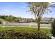 Scenic view of the condominium complex with lush greenery and a parking lot at 10720 Hill Point Ct, Charlotte, NC 28262