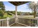 Scenic porch view of the condominium complex with lush greenery and a parking lot at 10720 Hill Point Ct, Charlotte, NC 28262