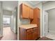 A kitchen showcases wooden cabinetry, a light countertop, and light green walls at 10720 Hill Point Ct, Charlotte, NC 28262