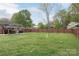 Large backyard featuring a gazebo, fence line, and mature trees at 1121 Rembrandt Sw Dr, Concord, NC 28027