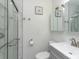 Bathroom featuring a shower, toilet, vanity with storage, and a mirrored medicine cabinet at 1121 Rembrandt Sw Dr, Concord, NC 28027