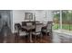 Bright dining room with hardwood floors, traditional molding, and sliding glass doors to the backyard at 1121 Rembrandt Sw Dr, Concord, NC 28027