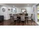 Dining room with hardwood floors, modern furniture, and access to other rooms in the home at 1121 Rembrandt Sw Dr, Concord, NC 28027