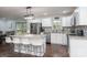 Bright kitchen features granite countertops, an island with seating, stainless steel appliances, and modern lighting at 1121 Rembrandt Sw Dr, Concord, NC 28027
