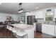 Bright kitchen with granite countertops, a central island, stainless steel appliances, and an open layout at 1121 Rembrandt Sw Dr, Concord, NC 28027