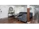 Cozy living room features hardwood floors, an accent mirror, plush seating, and ample natural light at 1121 Rembrandt Sw Dr, Concord, NC 28027