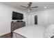 Main bedroom with hardwood floors, a large window, and a dresser with a large TV at 1121 Rembrandt Sw Dr, Concord, NC 28027
