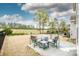 Outdoor patio showcases comfortable seating, a grill, and a fire pit with expansive backyard views at 123 Abersham Dr, Mooresville, NC 28115