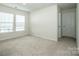 Neutral bedroom with natural light and plush carpeting at 123 Abersham Dr, Mooresville, NC 28115