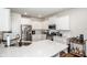 Modern kitchen featuring white cabinets, stainless steel appliances, and a quartz countertop island at 123 Abersham Dr, Mooresville, NC 28115