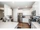Bright kitchen with white cabinets, stainless steel appliances, quartz countertops, and modern features at 123 Abersham Dr, Mooresville, NC 28115