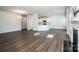Open-concept living area featuring hardwood floors, white trim, and kitchen view at 123 Abersham Dr, Mooresville, NC 28115