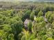 A stunning aerial view of a home surrounded by lush greenery, a peaceful retreat at 1320 Huntcliff Dr, Waxhaw, NC 28173