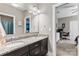 This bathroom features double sinks, granite countertops, and a large mirror at 1320 Huntcliff Dr, Waxhaw, NC 28173