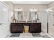 Bathroom featuring double sinks, granite countertops, and a walk-in shower, providing a modern and functional space at 1320 Huntcliff Dr, Waxhaw, NC 28173
