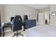 This bedroom features carpeted floors, neutral colored walls, and bright lighting at 1320 Huntcliff Dr, Waxhaw, NC 28173
