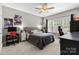 This bedroom features lots of natural light, a ceiling fan, and neutral colored walls at 1320 Huntcliff Dr, Waxhaw, NC 28173