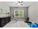Well-lit exercise room with natural light, exercise bike, and yoga mat provides a dedicated space for fitness at 1320 Huntcliff Dr, Waxhaw, NC 28173