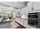 Well-equipped kitchen with dark countertops, stainless steel appliances, and bright white cabinets at 1320 Huntcliff Dr, Waxhaw, NC 28173