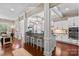 Bright, open kitchen with bar seating and a view into the living room, complete with modern appliances at 1320 Huntcliff Dr, Waxhaw, NC 28173