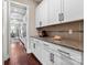 Modern kitchen featuring white cabinets, granite countertops, stainless steel appliances, and hardwood floors at 1320 Huntcliff Dr, Waxhaw, NC 28173