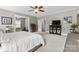 Comfortable main bedroom with neutral walls, carpet, and access to an exercise room, creating a relaxing retreat at 1320 Huntcliff Dr, Waxhaw, NC 28173