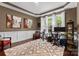 Cozy home office with stylish decor, a large window for natural light, and hardwood floors at 1320 Huntcliff Dr, Waxhaw, NC 28173